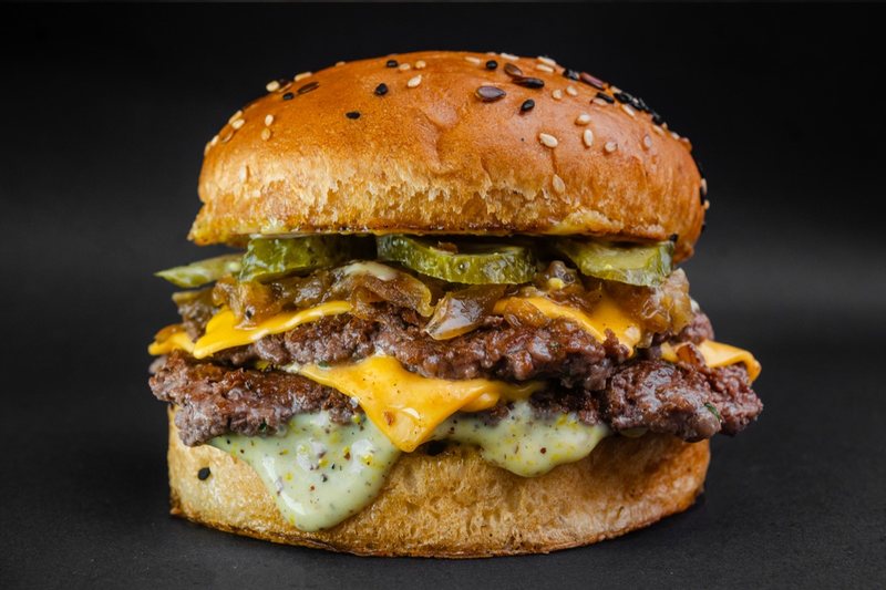 A Jimis Burger smash-hit — toasted bun, melted cheese, hand-pressed patty.